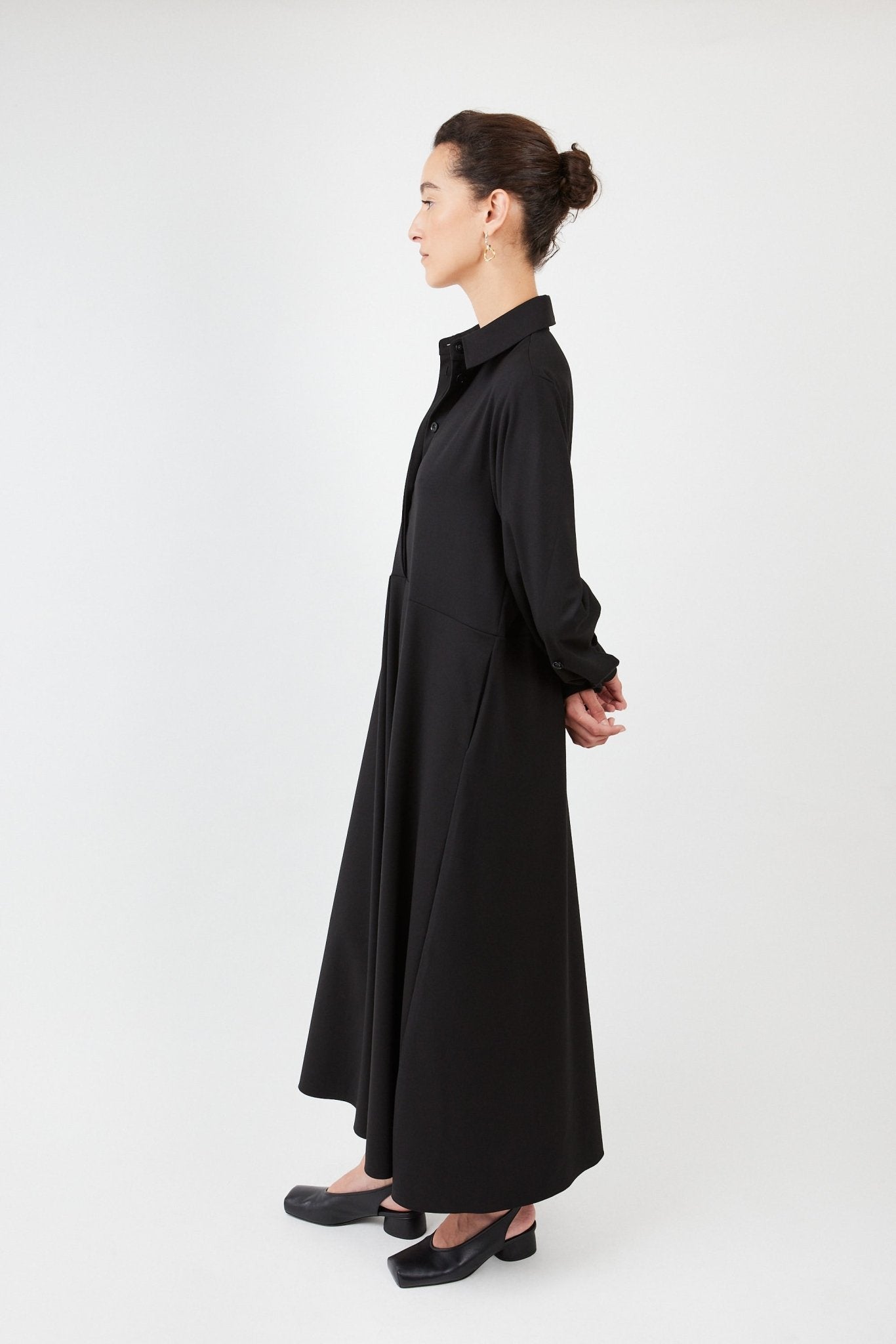 Model wearing midi shirt dress with elegant drape and modern fit | Black - Maison Marron et amis