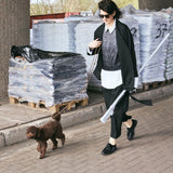 Black hybrid suit jacket worn open on the street while walking a dog - Maison Marron et amis