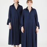 Model wearing midi shirt dress with elegant drape and modern fit| Navy - Maison Marron et amis