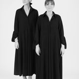 Models wearing midi shirt dress with elegant drape and modern fit | Black - Maison Marron et amis