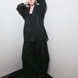 Black hybrid suit jacket worn open over the matching suit trousers - Maison Marron et amis