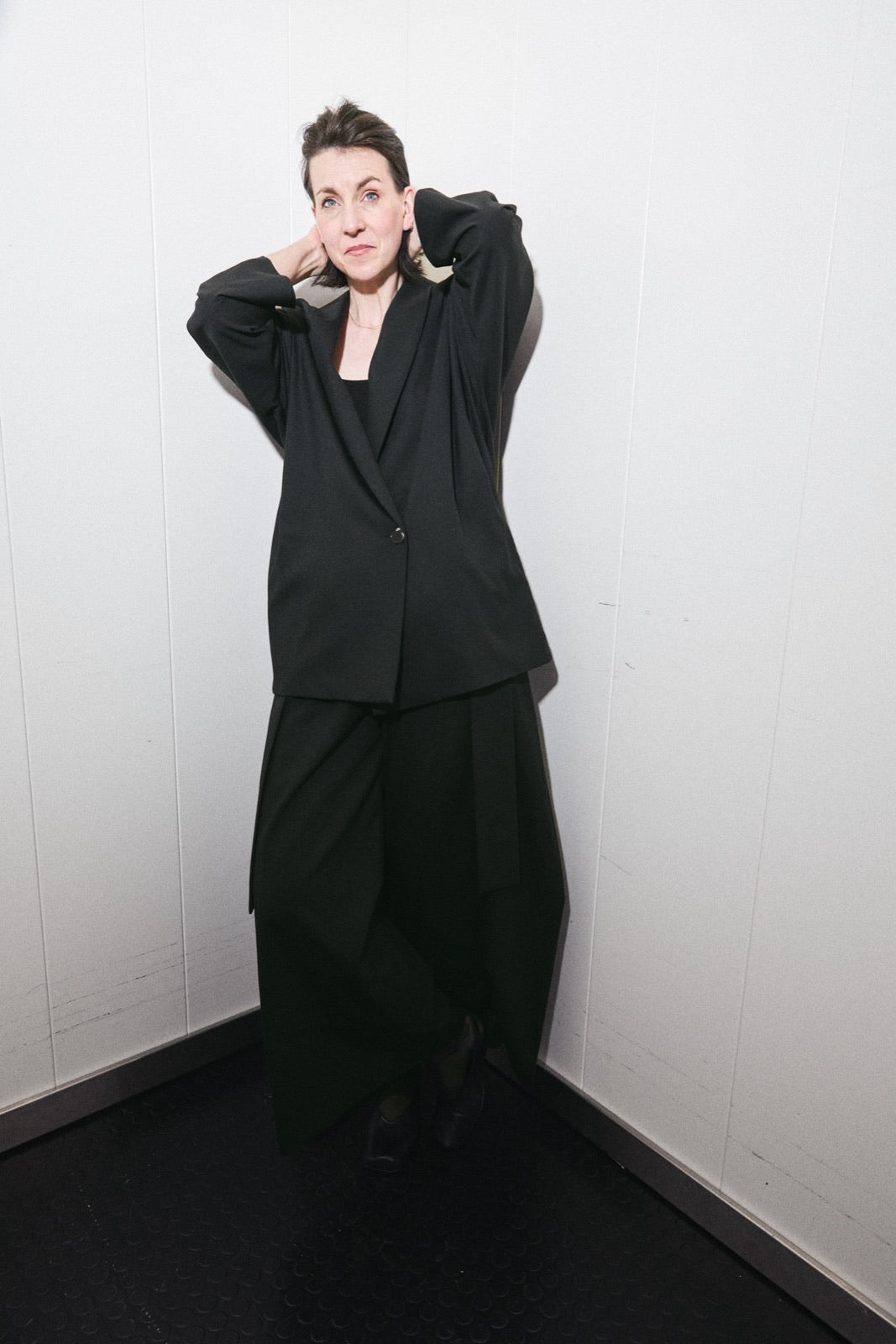 Black hybrid suit jacket worn open over the matching suit trousers - Maison Marron et amis