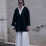 Cocoon Sweatshirt in black worn over the white Full-Length Shirt Dress - Maison Marron et amis
