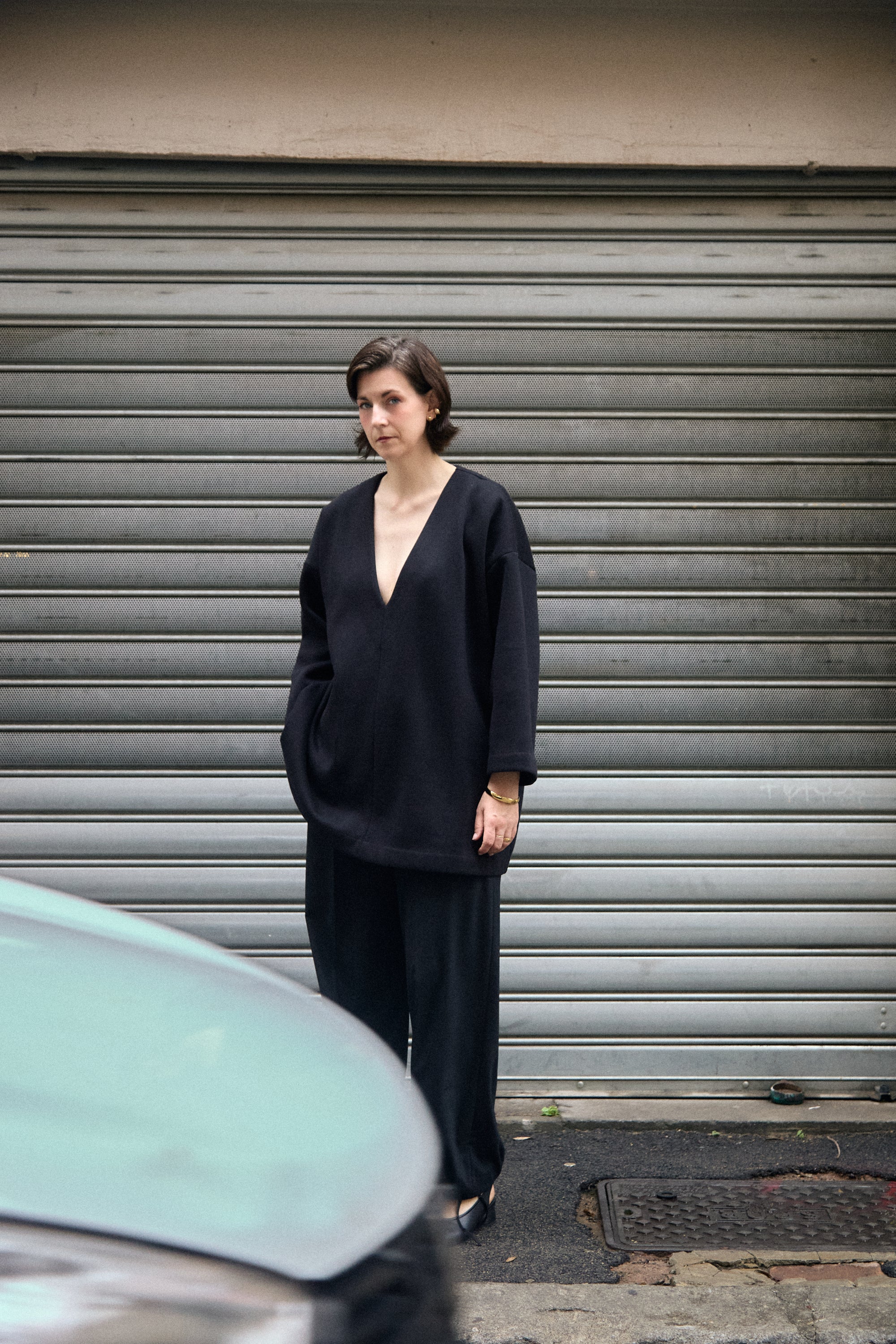 Cocoon Sweatshirt in black with deep V-neck, street view - Maison Marron et amis