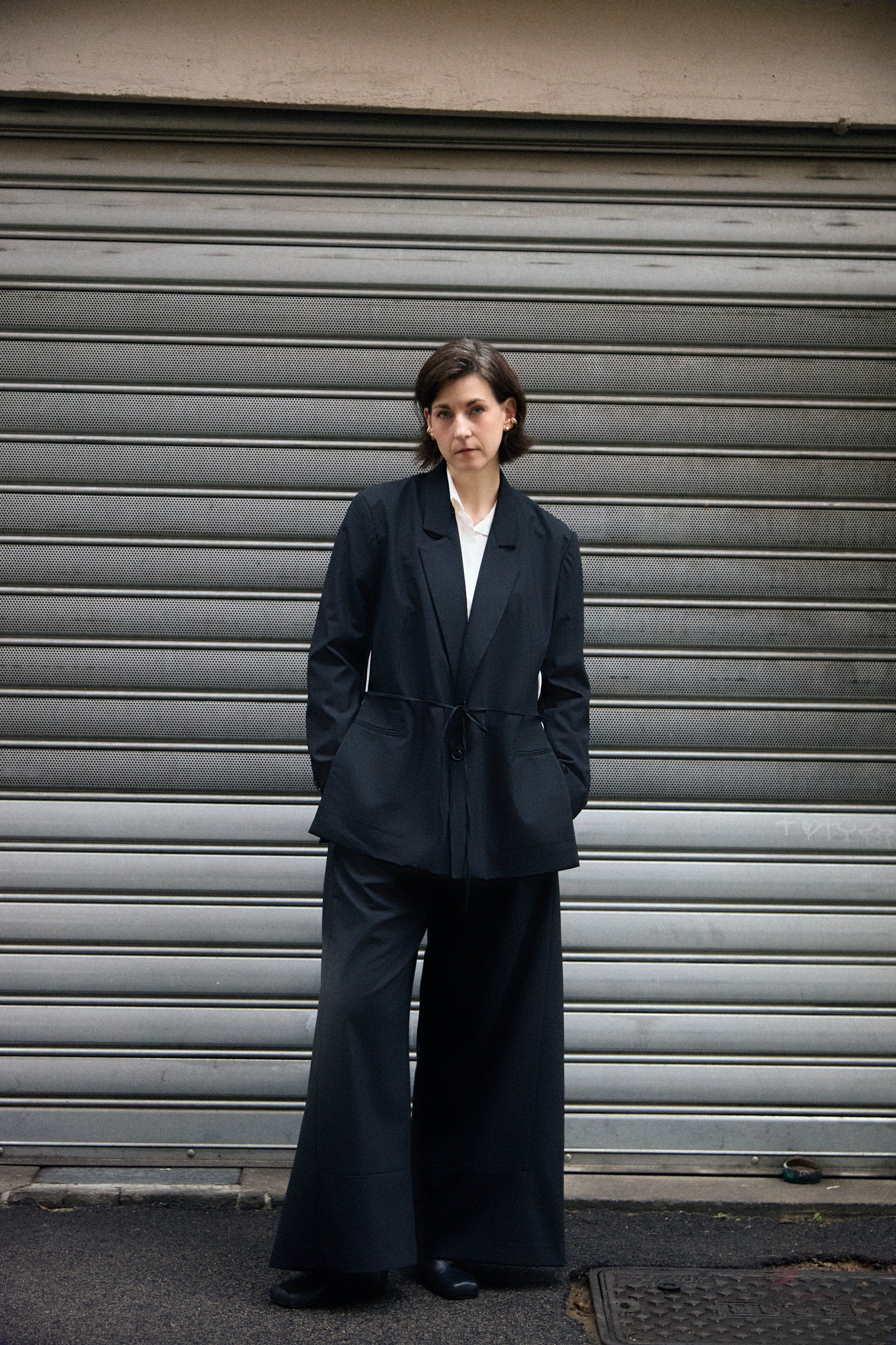 Open Side Blazer in black, belted at the waist over wide trousers - Maison Marron et amis