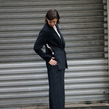 Open Side Blazer in black, side view showing the open side seam - Maison Marron et amis