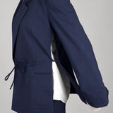Open Side Blazer in navy, side view with the arm raised and the side seam open - Maison Marron et amis