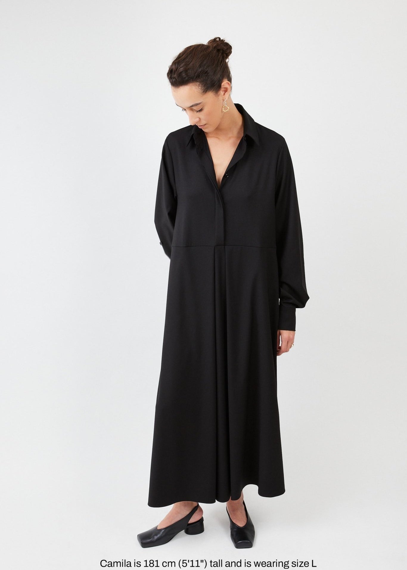 Model wearing midi shirt dress with elegant drape and modern fit | Black - Maison Marron et amis