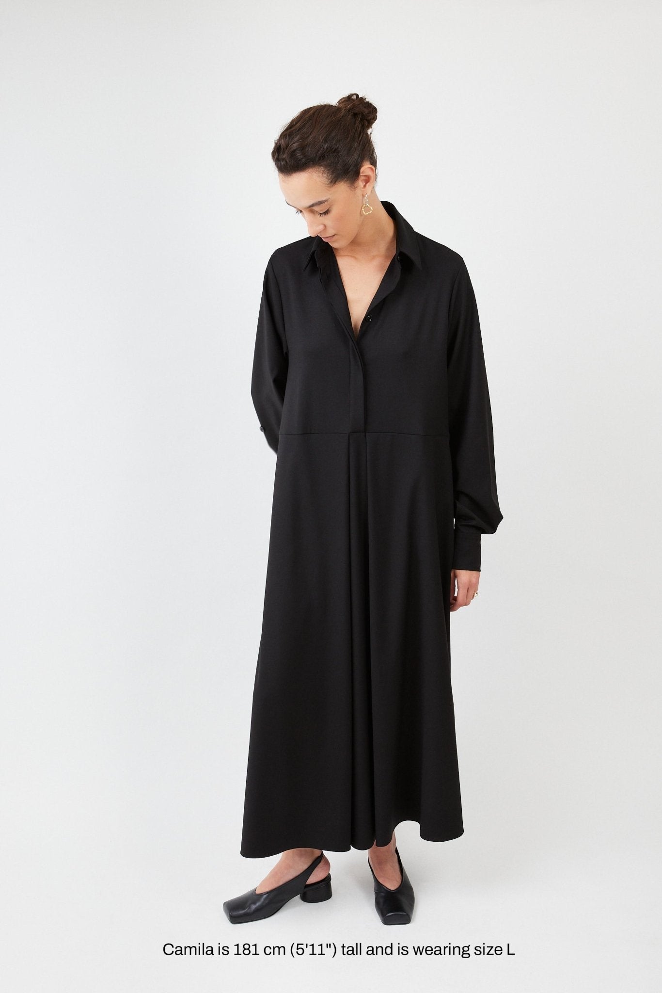 Model wearing midi shirt dress with elegant drape and modern fit | Black - Maison Marron et amis