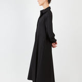 Model wearing midi shirt dress with elegant drape and modern fit | Black - Maison Marron et amis