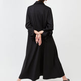 Model wearing midi shirt dress with elegant drape and modern fit | Black - Maison Marron et amis