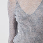 Close-up of ribbed texture and delicate shimmer on Grey Melange Merino wool sweater - Maison Marron et amis