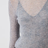 Close-up of ribbed texture and delicate shimmer on Grey Melange Merino wool sweater - Maison Marron et amis