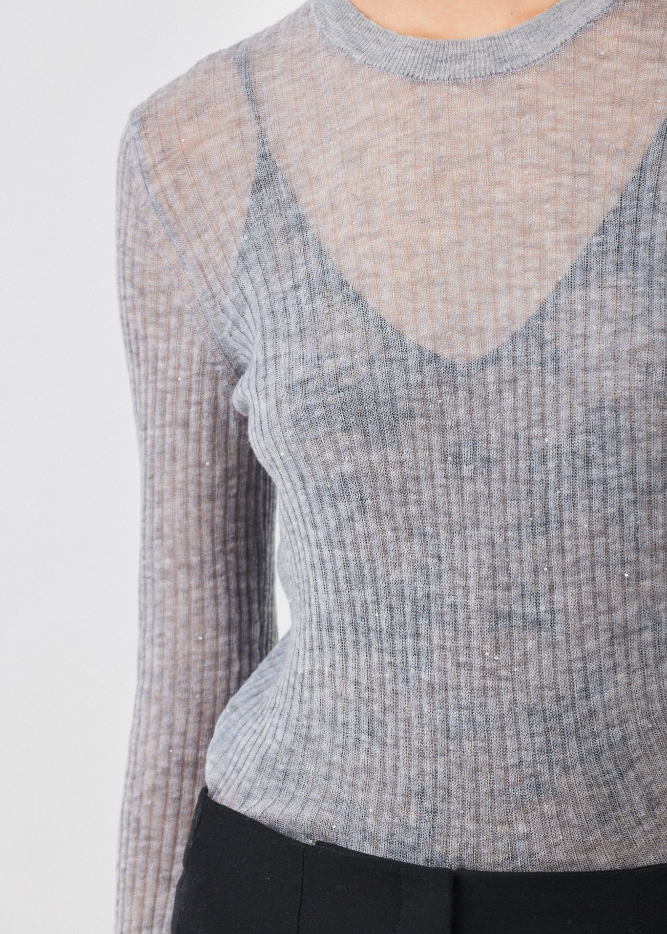 Close-up of ribbed texture and delicate shimmer on Grey Melange Merino wool sweater - Maison Marron et amis
