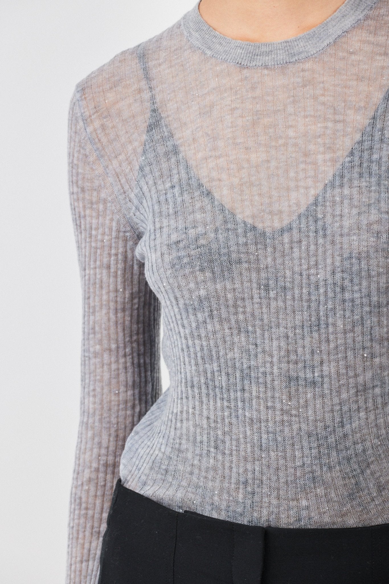 Close-up of ribbed texture and delicate shimmer on Grey Melange Merino wool sweater - Maison Marron et amis