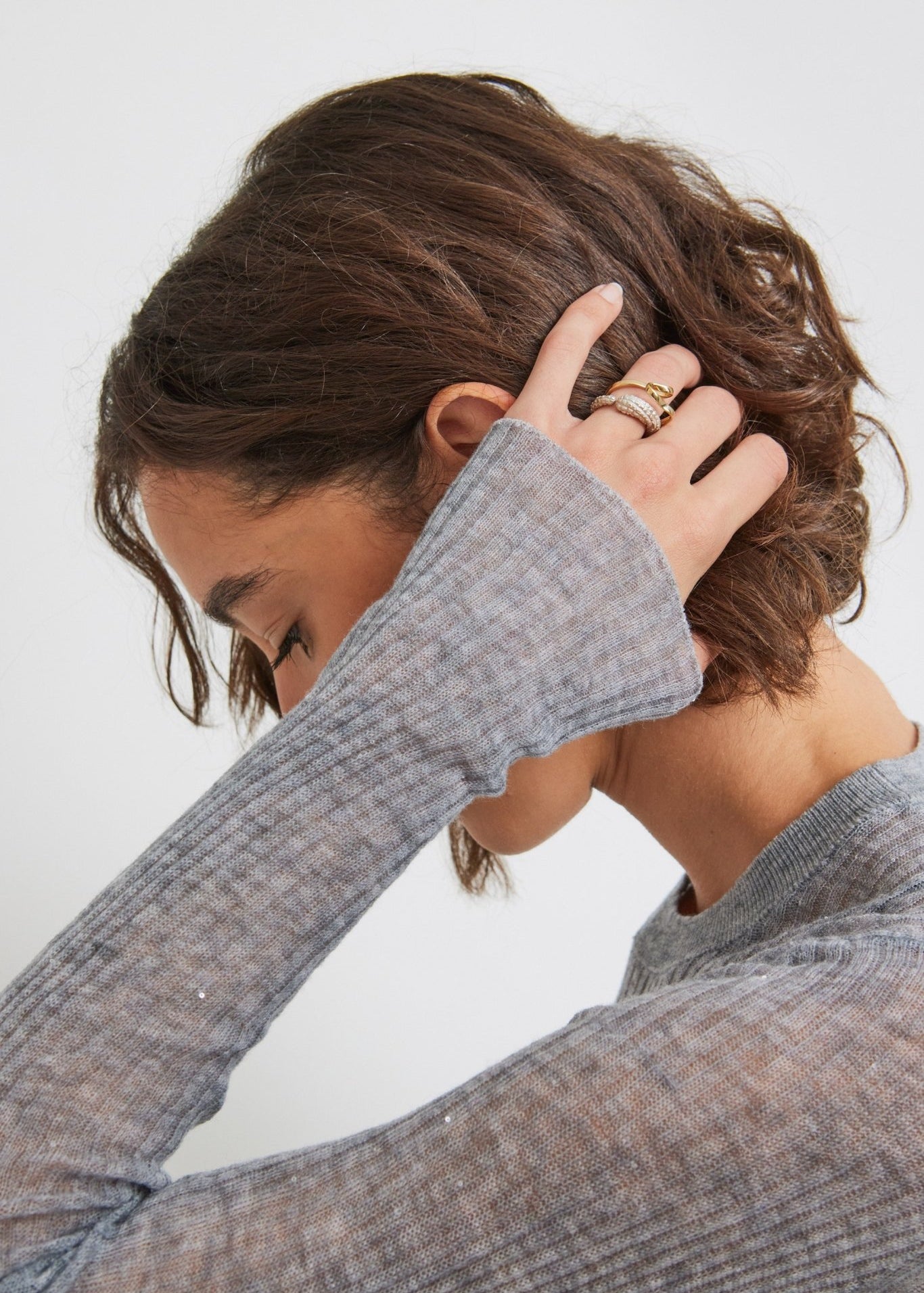 Close-up of ribbed texture and delicate shimmer on Grey Melange Merino wool sweater - Maison Marron et amis